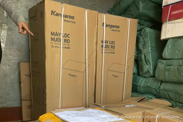 Two large boxes of Kangaroo water purifiers and other parcels in a warehouse.